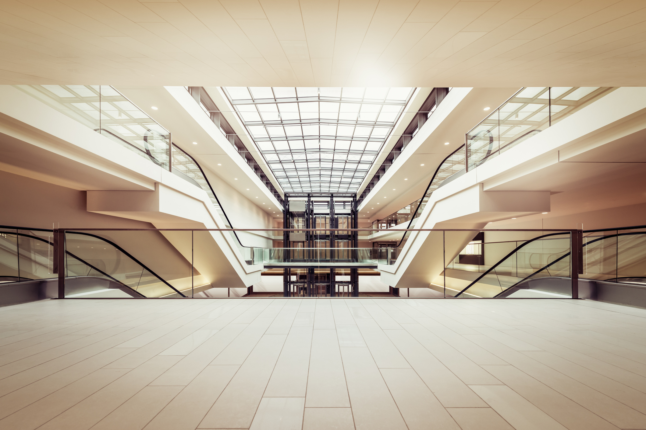 Commercial Escalators And Lifts In A Modern And Clean Shopping Mall